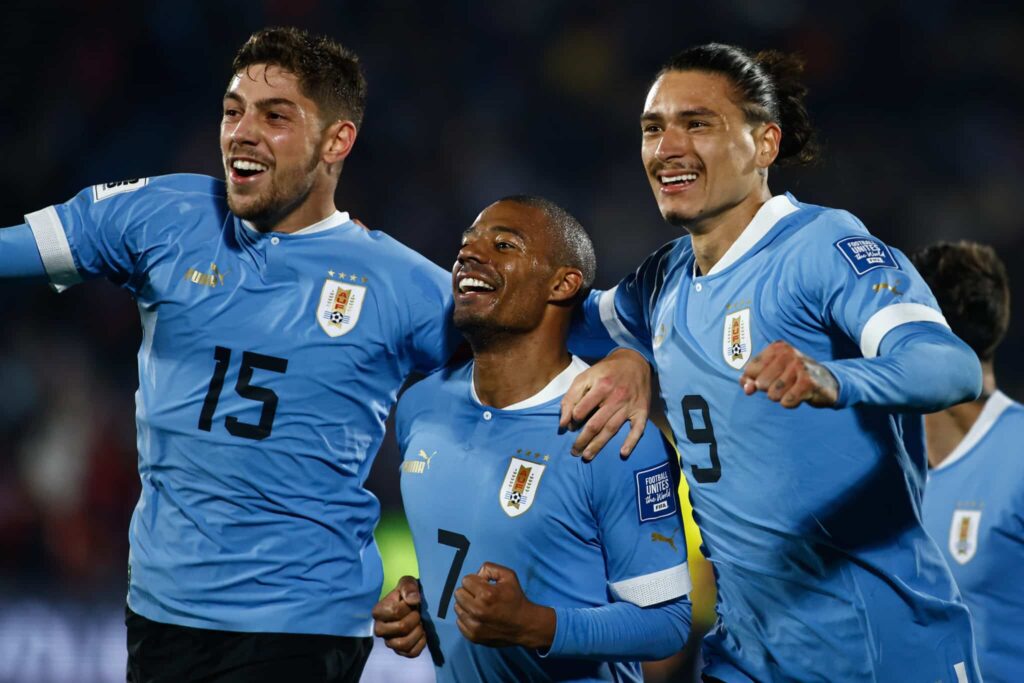 MONTEVIDEO, URUGUAY - SEPTEMBER 08: Nicolas de la Cruz (C) of Uruguay celebrates with Federico Valverde (L) and Darwin Nuñez of Uruguay after scoring the third goal of their team during a FIFA World Cup 2026 Qualifier match between Uruguay and Chile at Centenario Stadium on September 08, 2023 in Montevideo, Uruguay. 